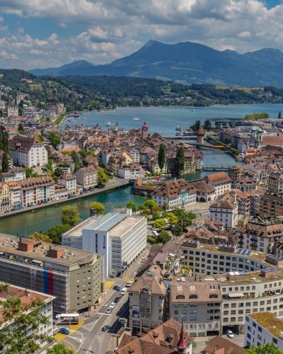 Stunning aerial view of Lucerne, showcasing its unique architecture along the lake and mountains.
