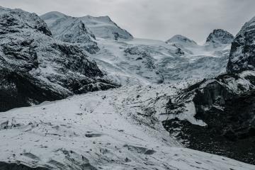 Breathtaking view of the snowy peaks in Graubünden, Switzerland, showcasing pristine winter wilderness.