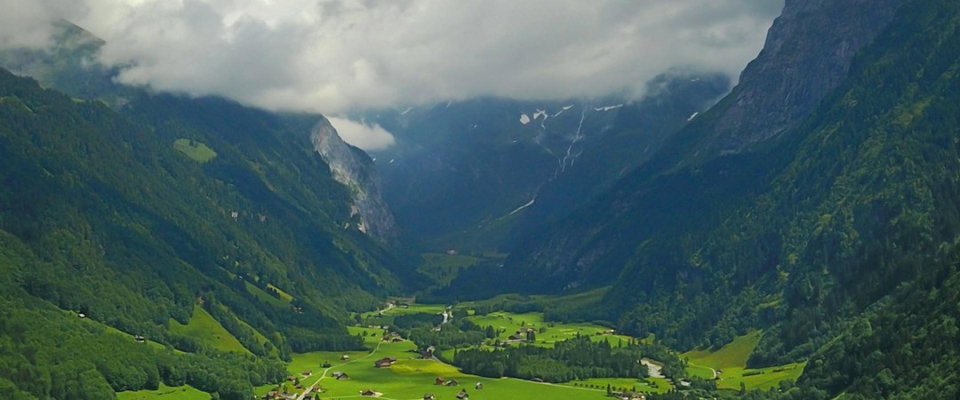 a landscape with a road and buildings