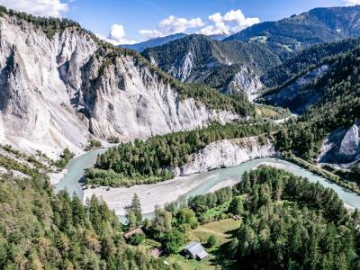 a river running through a valley between mountains