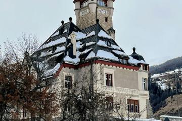 a large building with a clock on the top of it