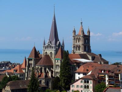 Lausanne Cathedral above the old town roofs, with Lake Geneva beyond