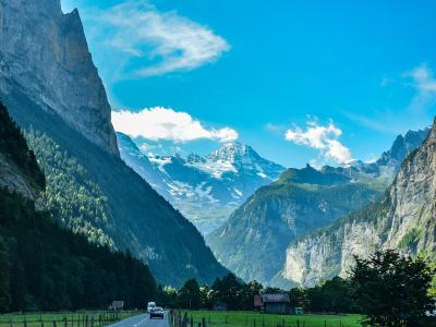 The Lauterbrunnen Valley floor between sheer cliffs, with snowy peaks at its head