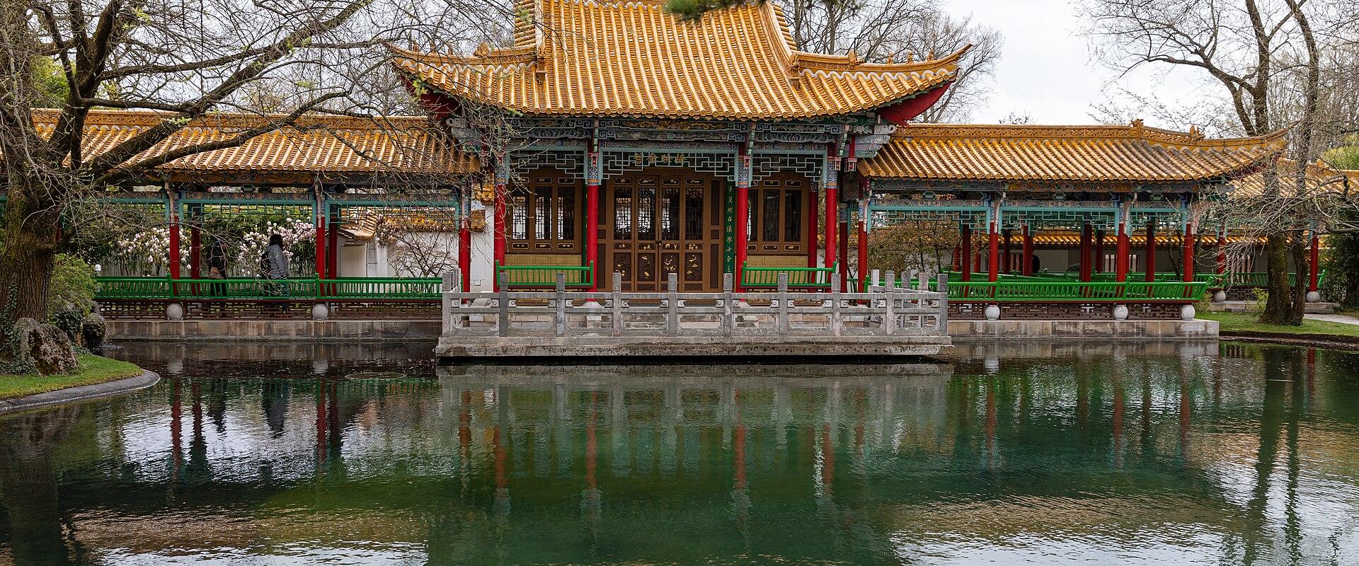 The pavilion of the Chinese Garden in Zürich reflected in its pond