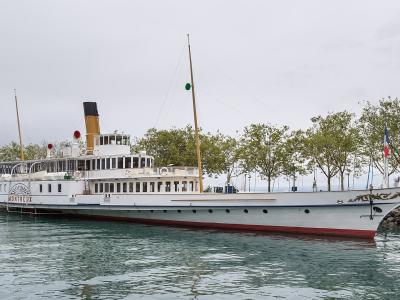 Paddle steamer Montreux moored at the tree-lined quay of Ouchy