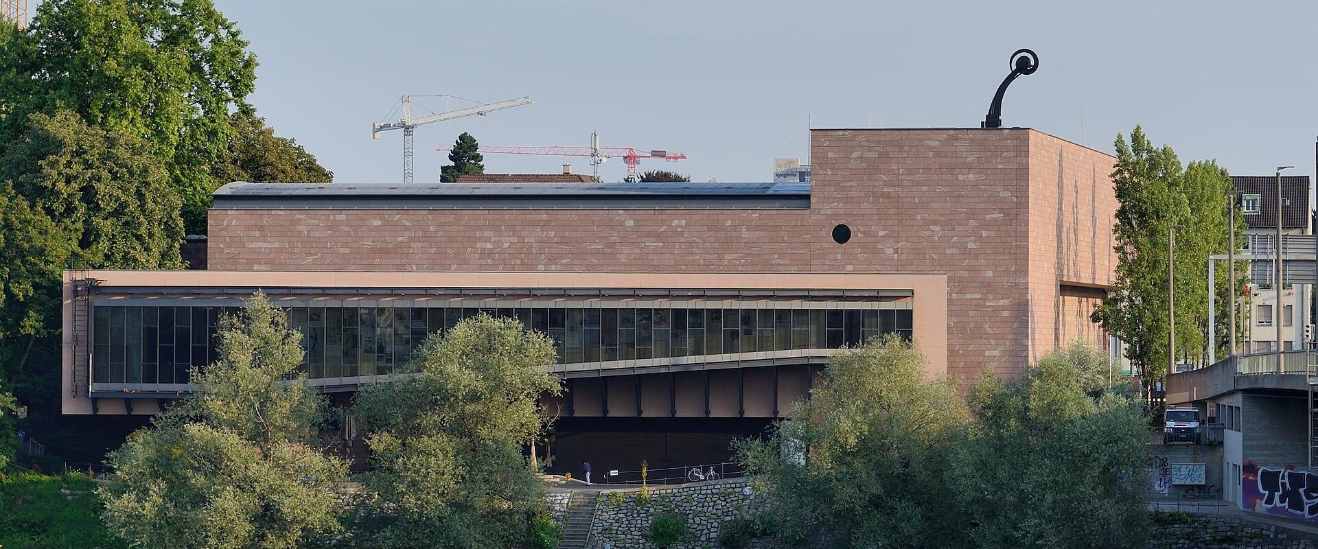 Mario Botta's Museum Tinguely building on the bank of the Rhine in Basel