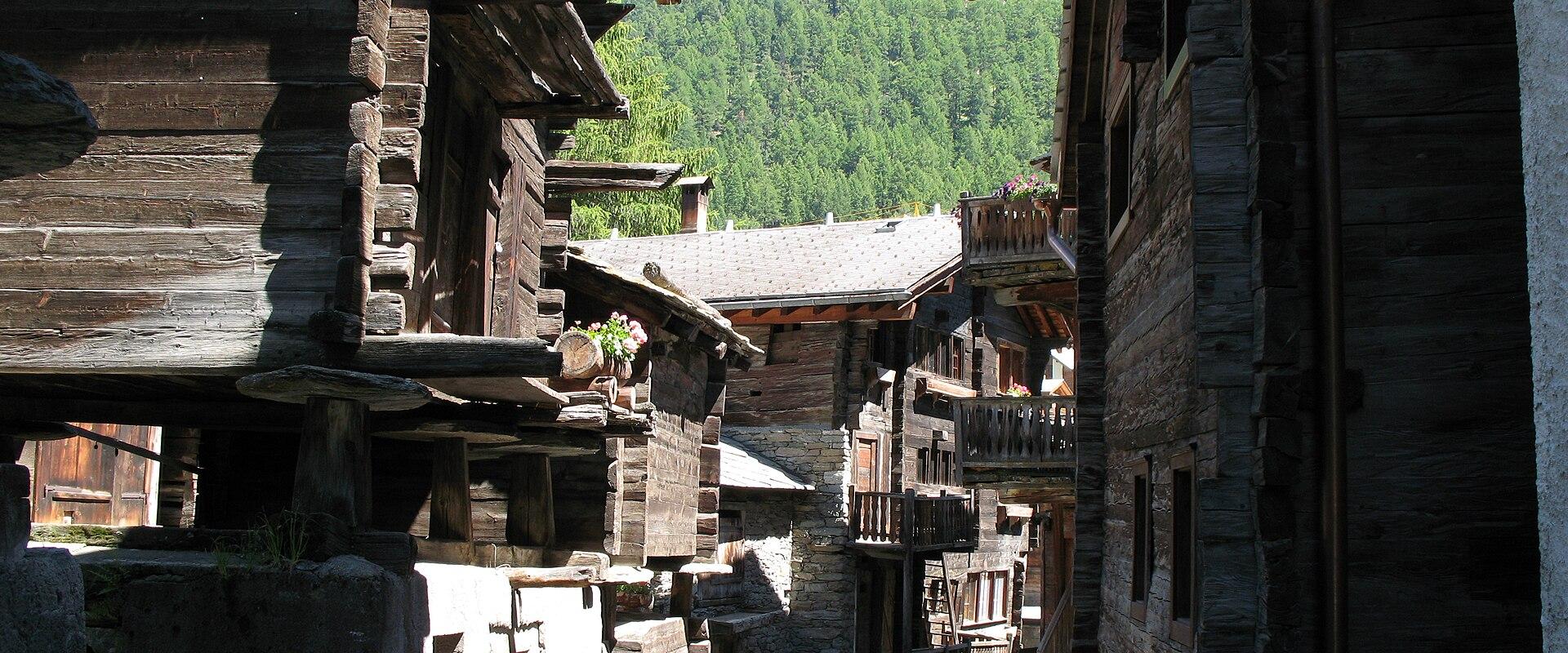 Old wooden larch barns and houses lining a lane in Zermatt's Hinterdorf