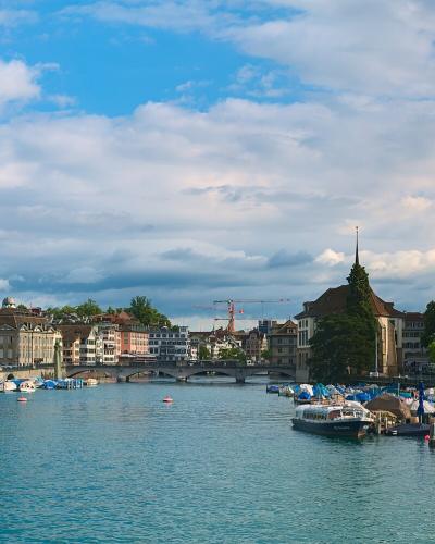Zurich's Limmat river with the Fraumünster and Grossmünster church towers, the city's iconic skyline view
