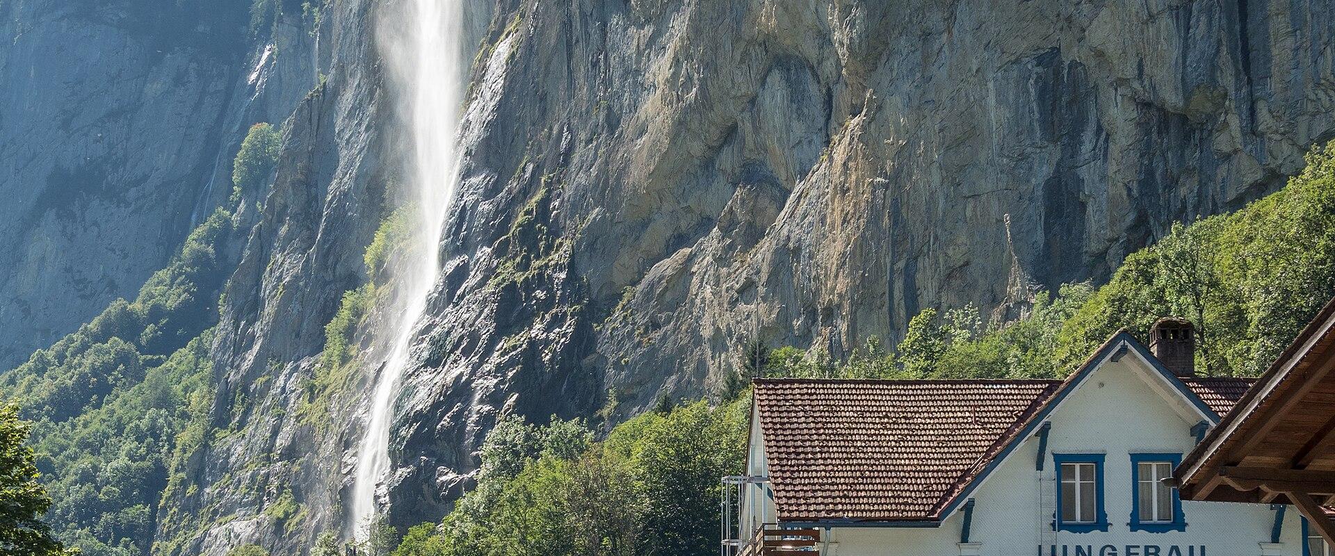 Staubbach Falls dropping from the cliff behind Lauterbrunnen village