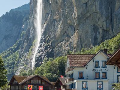 Staubbach Falls dropping from the cliff behind Lauterbrunnen village