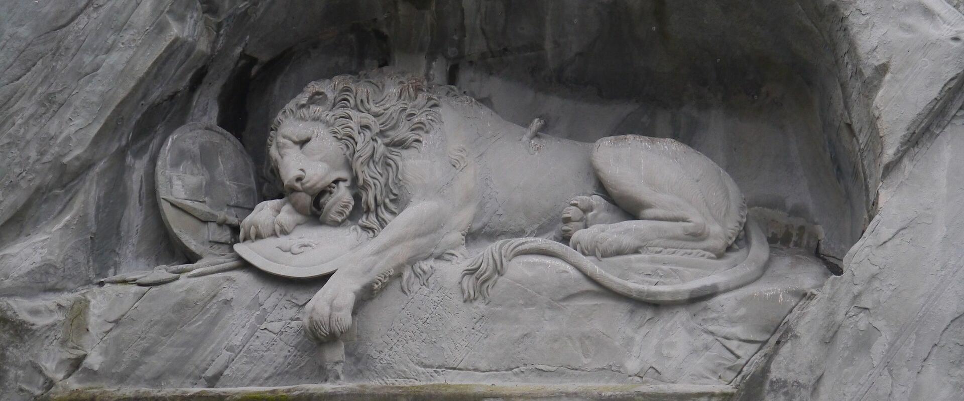 The dying lion of the Lion Monument carved into the rock face in Lucerne