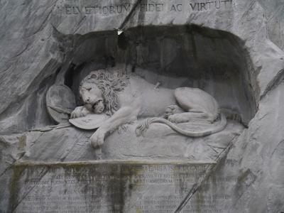 The dying lion of the Lion Monument carved into the rock face in Lucerne