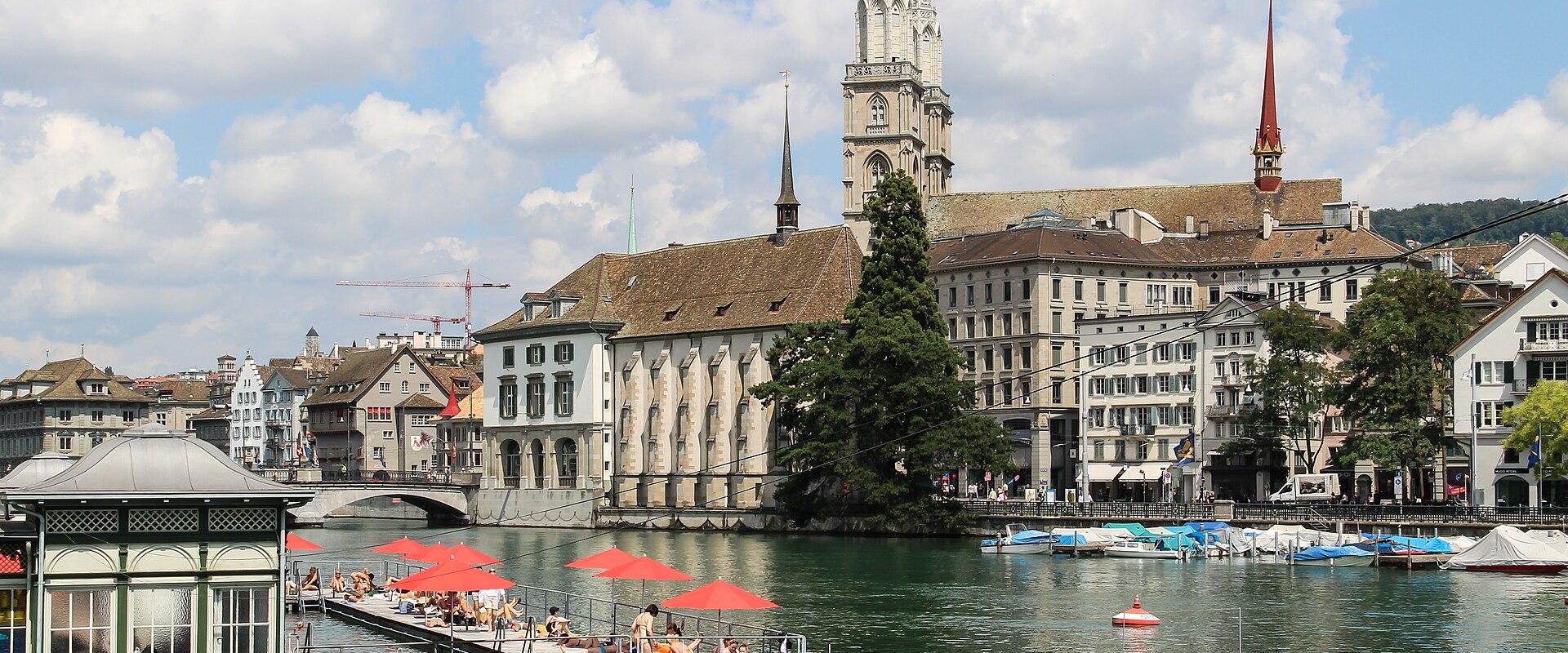 The Grossmünster towers and old town along the Limmat River in Zurich