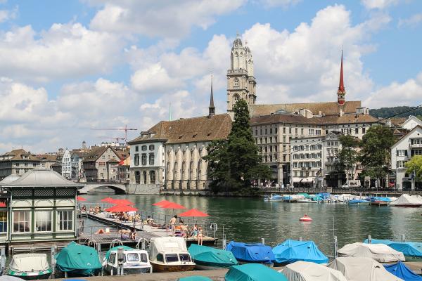 The Grossmünster towers and old town along the Limmat River in Zurich