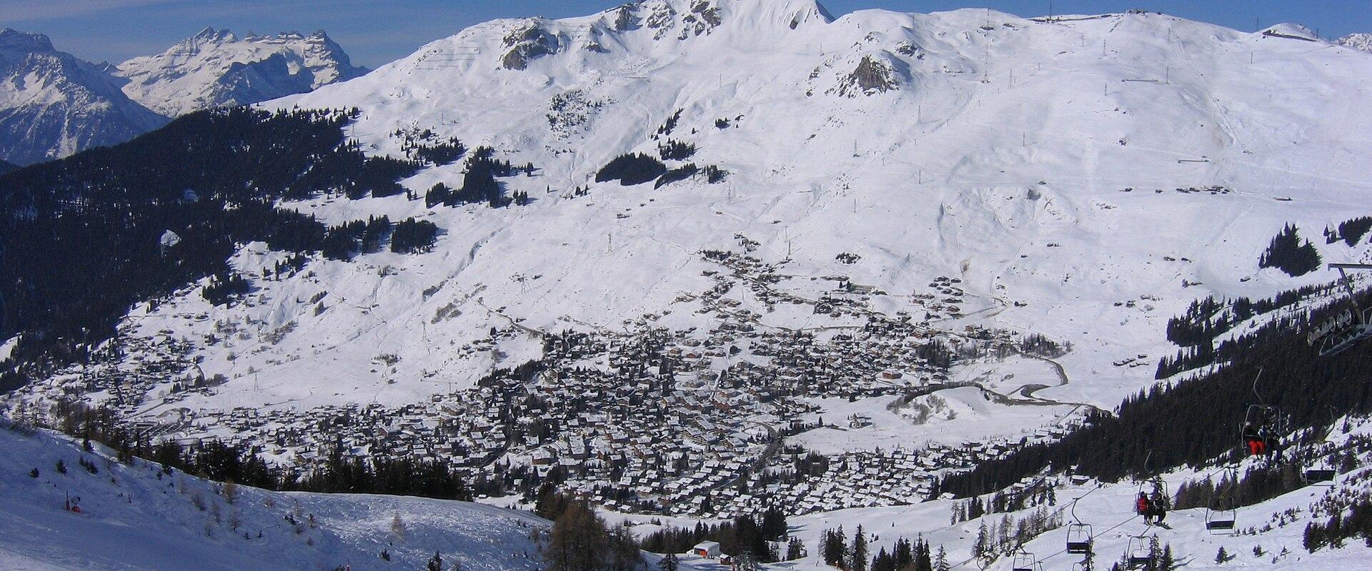 Verbier and its ski slopes in the Valais Alps under a clear winter sky