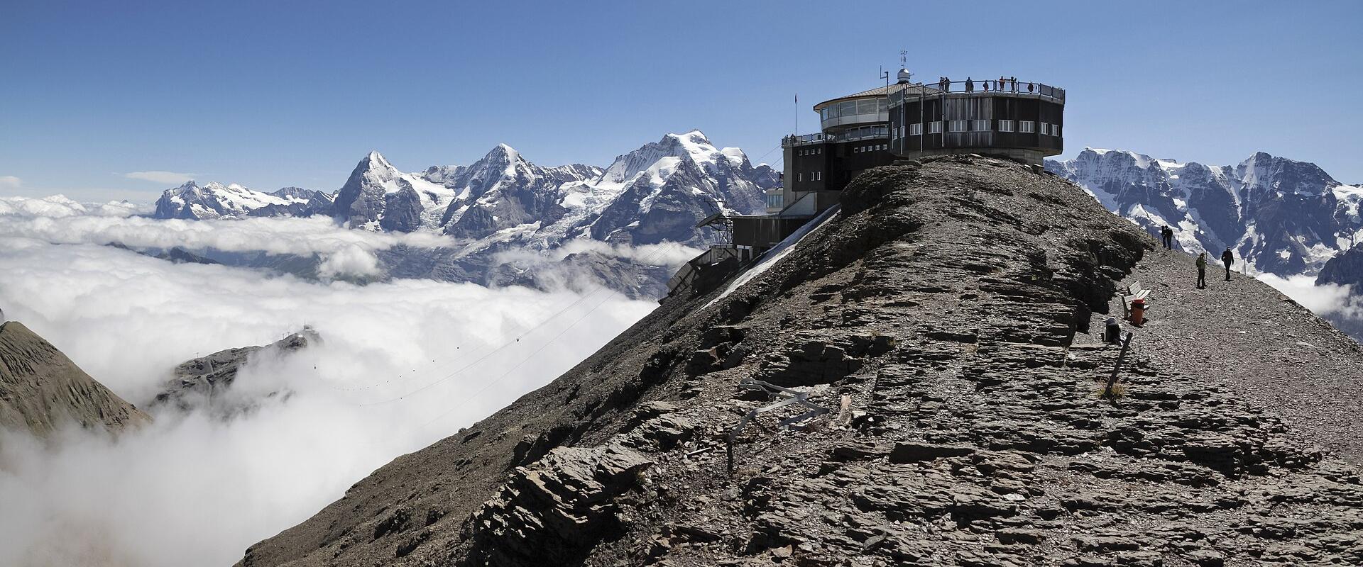 Piz Gloria on the Schilthorn summit above a sea of cloud