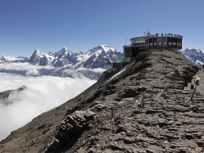 Piz Gloria on the Schilthorn summit above a sea of cloud