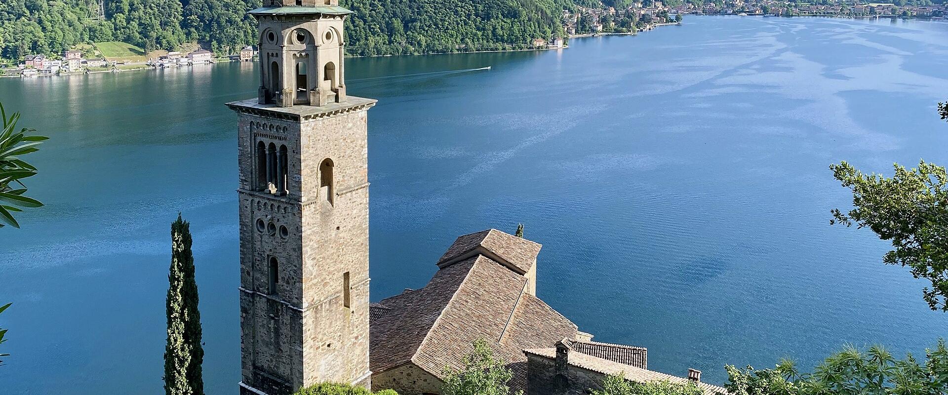 The bell tower of Santa Maria del Sasso above Morcote and Lake Lugano