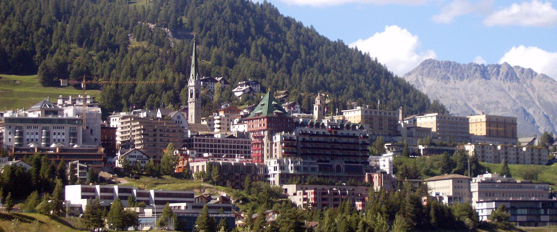 St. Moritz town rising above its lake
