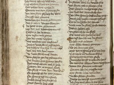 A two-page spread of a medieval manuscript written in Gothic script on aged parchment, with visible text columns and marginalia.